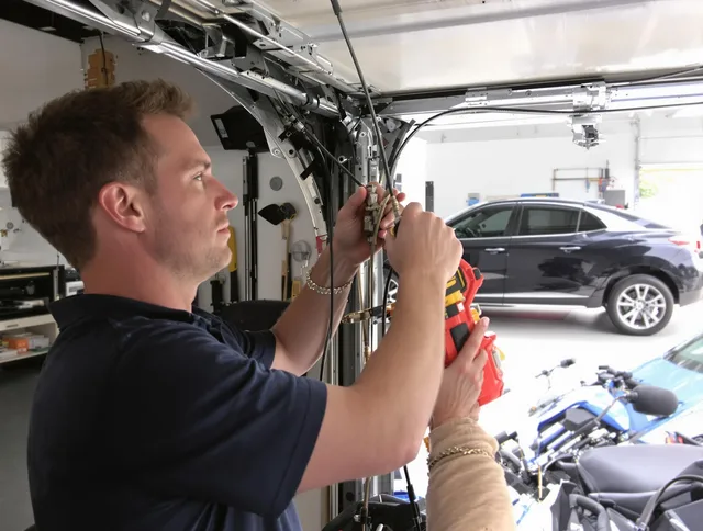 Shelton Garage Door Repair safety certified technician performing cable replacement in Shelton