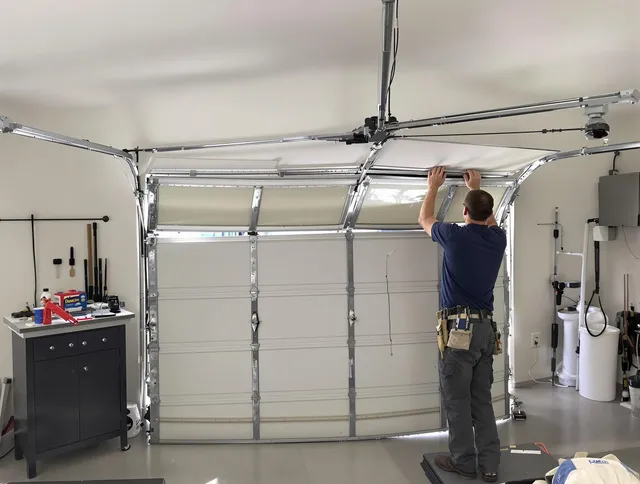 Shelton Garage Door Repair specialist performing precise section replacement on Shelton garage door